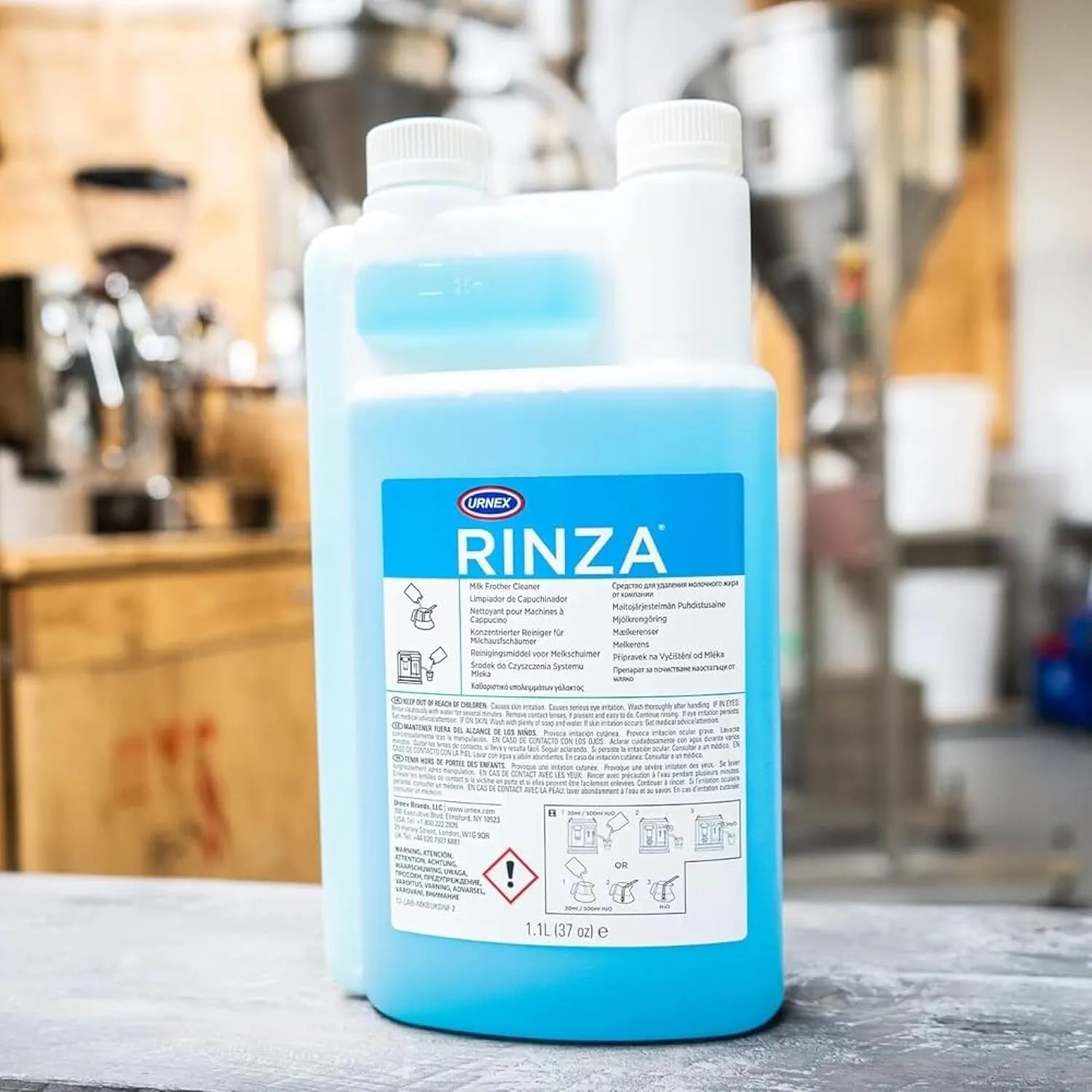 Product shot of a 33.6oz bottle of Rinza milk frother cleaner on counter